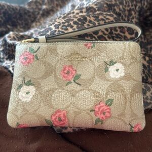 Coach corner zip wristlet floral pattern used like new